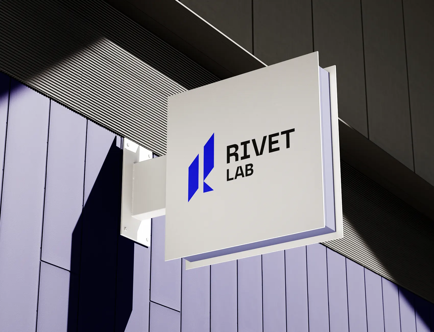 Señalización exterior con logo técnico de Rivet Lab.